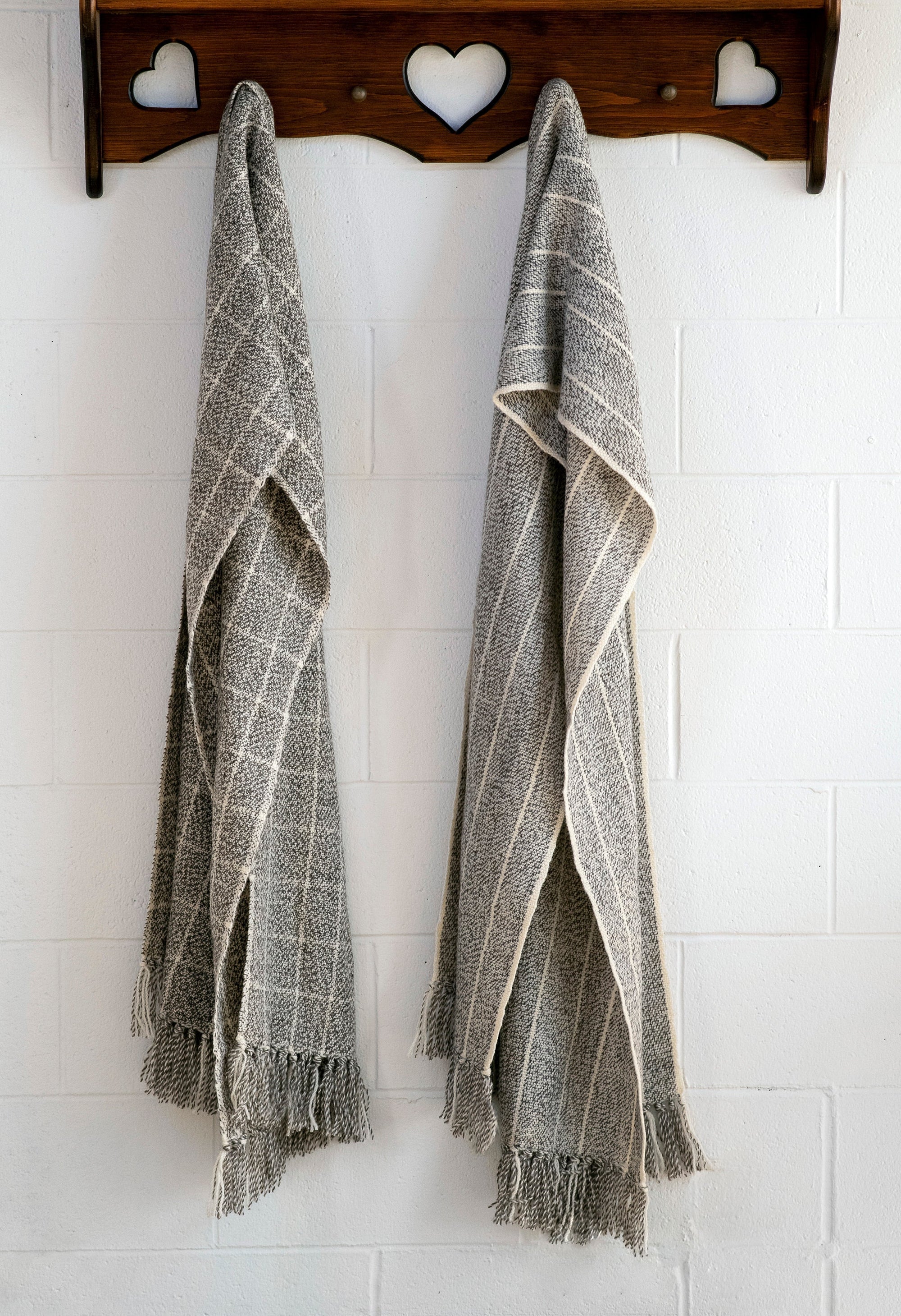 Large Blanket Scarves hanging on a perch