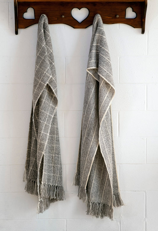 Large Blanket Scarves hanging on a perch