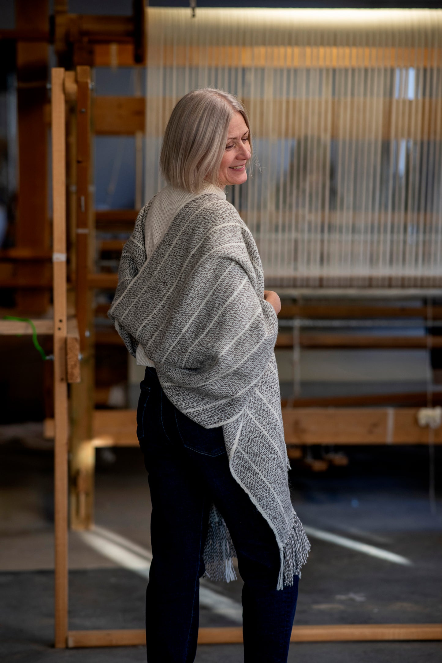 Woman wearing an extra large handmade in Edmonton blanket scarf