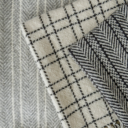 A classic herringbone pattern, these rich, earthy blanket brings timeless warmth and texture to any home or cabin.