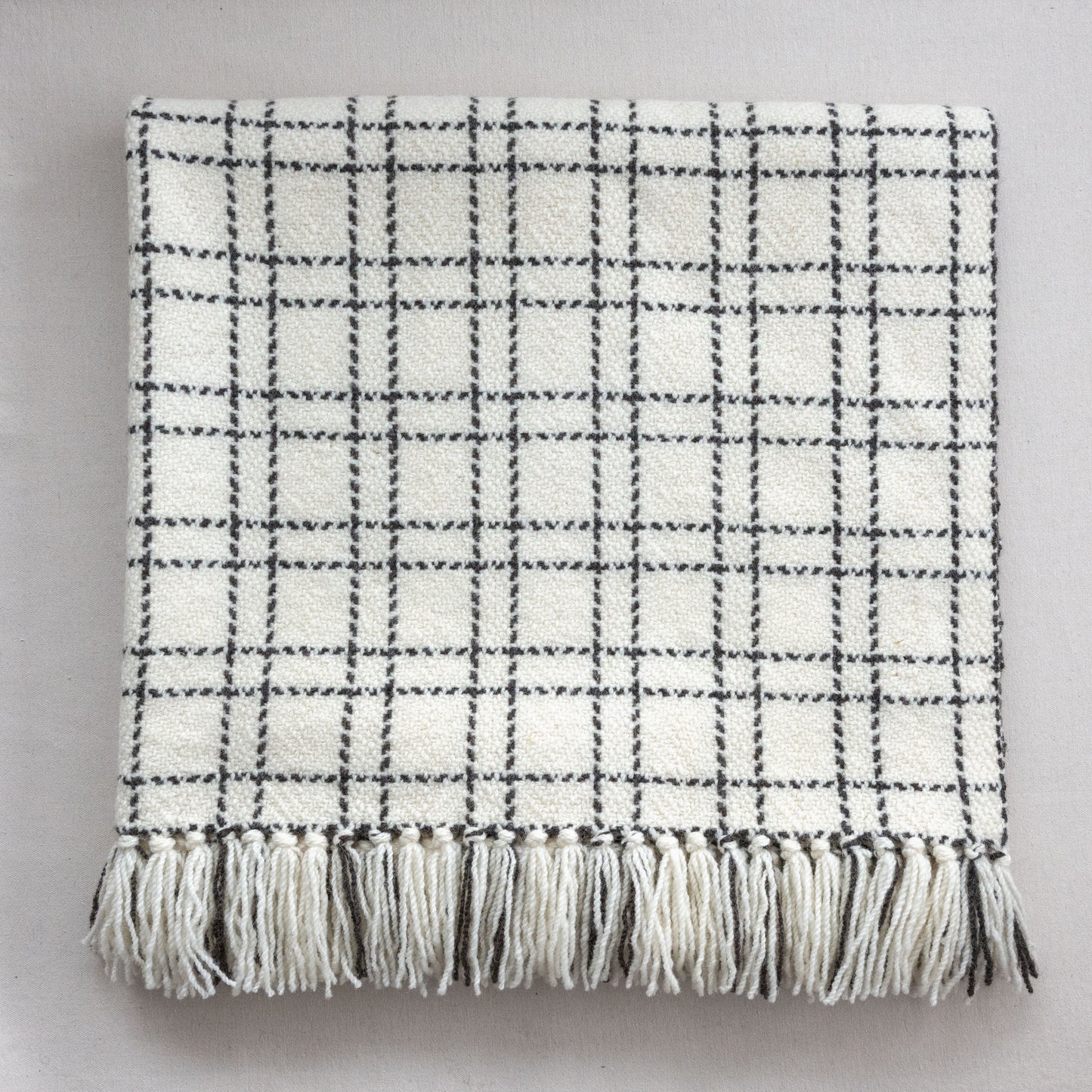 Handwoven blanket with a grid pattern  eco-friendly wool blanket made in Edonton