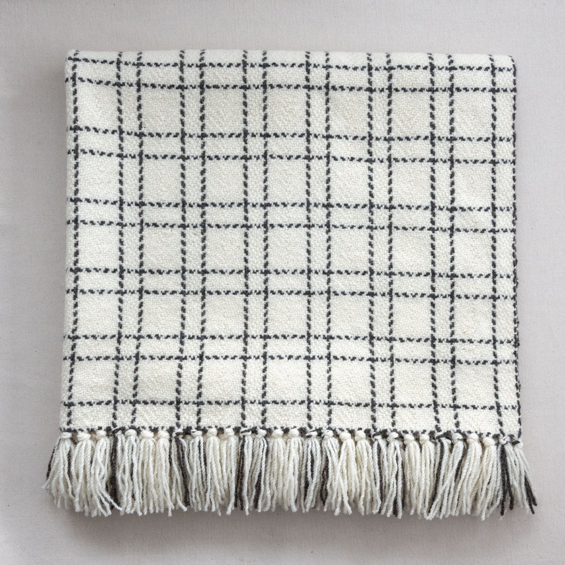 Handwoven blanket with a grid pattern  eco-friendly wool blanket made in Edonton