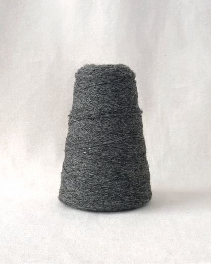 Gray skein of yarn on a white background